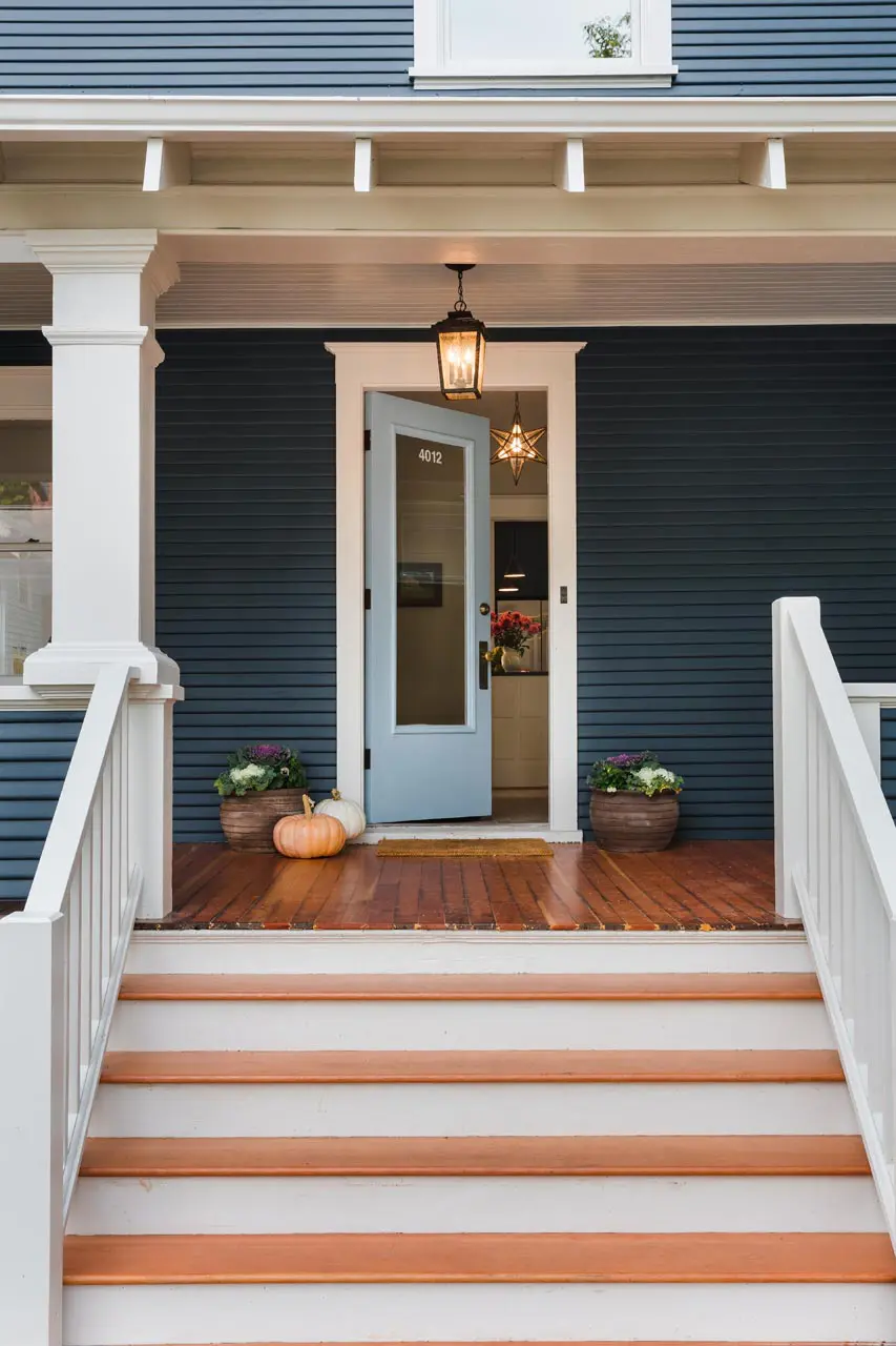 Traditional home with blue painted siding